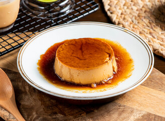 Smooth Caramel Egg Pudding with a Sweet Glaze in plate side view of taiwan food