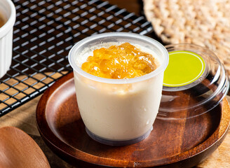 Hong Kong Style Peach Gum Stewed Milk Dessert in cup side view of taiwan food