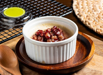 Red Bean Stewed Milk Dessert with Chinese Sweet Soup in bowl side view of taiwan food