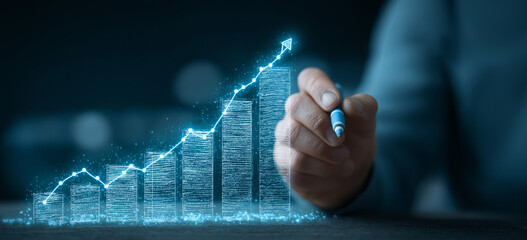 Businessman drawing a growth graph line with a digital screen and business data background for a market or financial banner