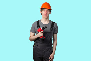 A young man with a screwdriver for construction work. Insulate.