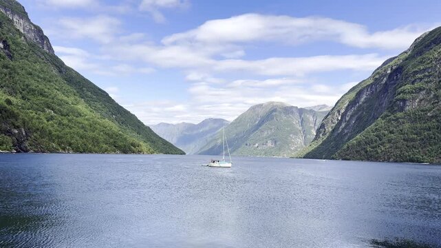 Yacht in the Norwegian fjords among the mountains