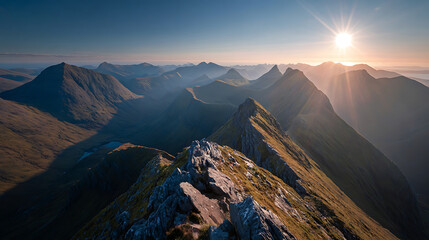 Majestic mountain range bathed in golden sunlight during sunrise peaks