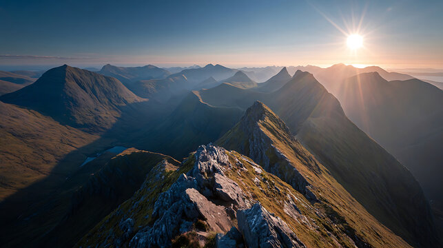 Majestic mountain range bathed in golden sunlight during sunrise peaks
