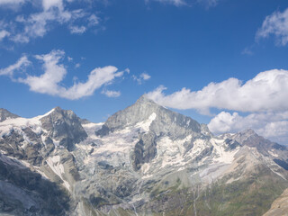 Mettelhorn, Switzerland - August 24th 2024: Impressive view from the summit towards Weisshorn peak.