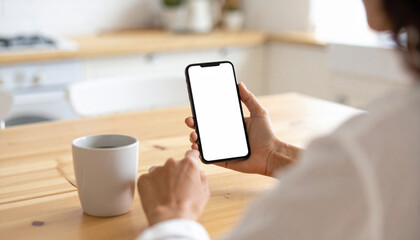 Close-up of woman’s hands holding breakfast and smartphone, multitasking morning routine, back to work preparation

