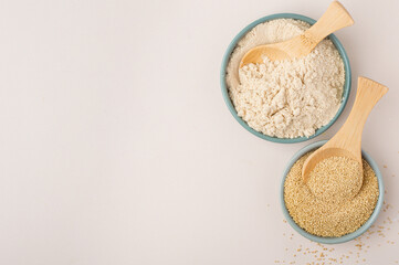 Whole grain and amaranth flour in a bowl on a light background. Healthy eating concept, vegan.