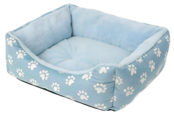 Blue plush pet bed with white paw prints, cozy dog or cat cushion isolated on transparent background