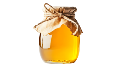A jar of honey is sitting on a white background. The jar is made of glass and has a brown cloth tied around it. The honey inside the jar is golden in color