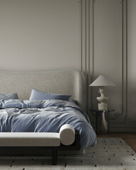 Close-up of a modern cozy bed with soft blue bedding, textured headboard, and sculptural table lamp on side table.