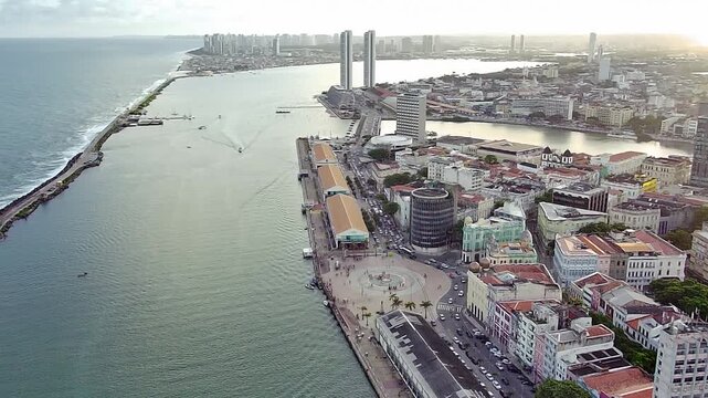 Stunning aerial panorama of the Historic Center of Recife, with the Francisco Brennand Sculpture Park on the breakwater, the port, and the modern city skyline in Pernambuco, Brazil.