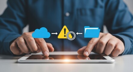 Person using a tablet displaying a digital warning symbol between cloud storage and a file folder icon signifying data transfer concerns