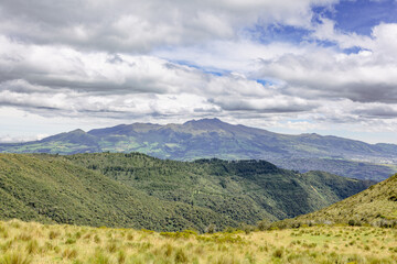 Pichincha Province, Quito, Ecuador - July 5, 2025: View of the Pichincha Integral, heart Volcano, among others, from the Pasochoa Volcano, in the Pasochoa Wildlife Refuge.