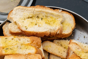 A comforting platter of freshly prepared bread with olive oil and oregano. This simple, flavorful...