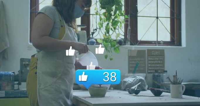 Female potter pouring clay slip into mold and generating animated likes for social media marketing