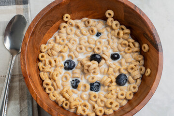 bowl of cereal   with blue berries on top