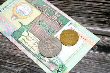 Kuwaiti old coins on Kuwaiti half dinar features coat of arms of Kuwait, vignette of Kuwaiti money...