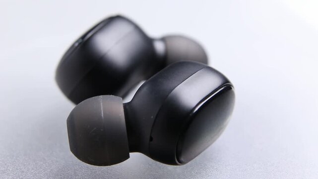 Macro Close up of Bluetooth portable true wireless earbuds

