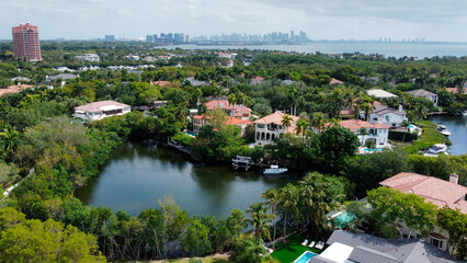 Naklejka premium Luxury waterfront homes in Cocoplum, Coral Gables with Miami skyline view