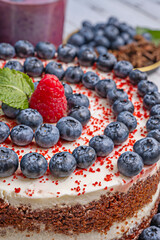 Red Velvet with Blueberry Sauce: Thick red berry coulis decorated on a plate using an abstract painting technique