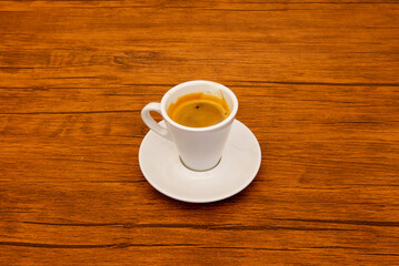 The morning ritual in a photo: a steaming cup of latte, with its sweet aroma and smooth texture...