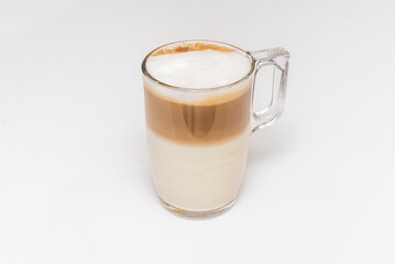 Moment of calm: freshly brewed cup of latte, steaming with a delicate pattern in the foam