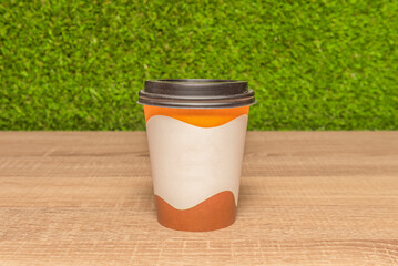 Comforting simplicity: a coffee with milk served in a white cup, highlighting the contrast between the dark liquid and the golden foam