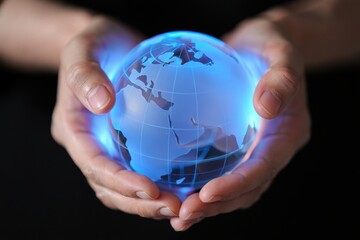 Hands holding a glowing blue globe representing global connection and future