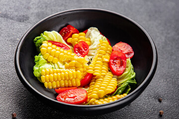 Corn salad tomato fresh vegetables snack fresh delicious gourmet food background on the table  rustic food top view copy space keto and paleo diet vegetarian and vegan food