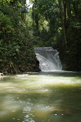 Female tourists exploring Siete Altares, which is a natural attraction located near Livingston,...
