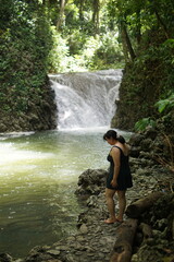 Female tourists exploring Siete Altares, which is a natural attraction located near Livingston,...