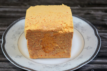 Yellow Feta cheese with turmeric and pepper, Feta is a Greek brined white cheese made from sheep...