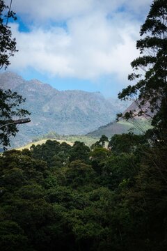 Green Mountains and Cloudy Sky