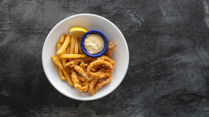Plate of Fried Calamari with French Fries and Tartar Sauce