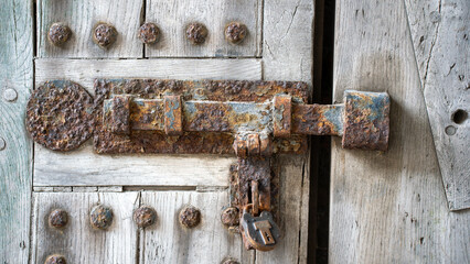 Lock bolt rust door wood security old vintage antique history padlock metal detail texture past...