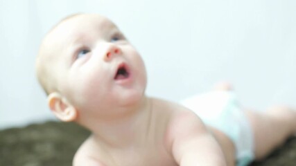 Adorable Baby Boy Lying on Soft Blanket Isolated on White Background