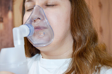a person using a nebulizer mask healthcare and medical services respiratory care asthma treatment...