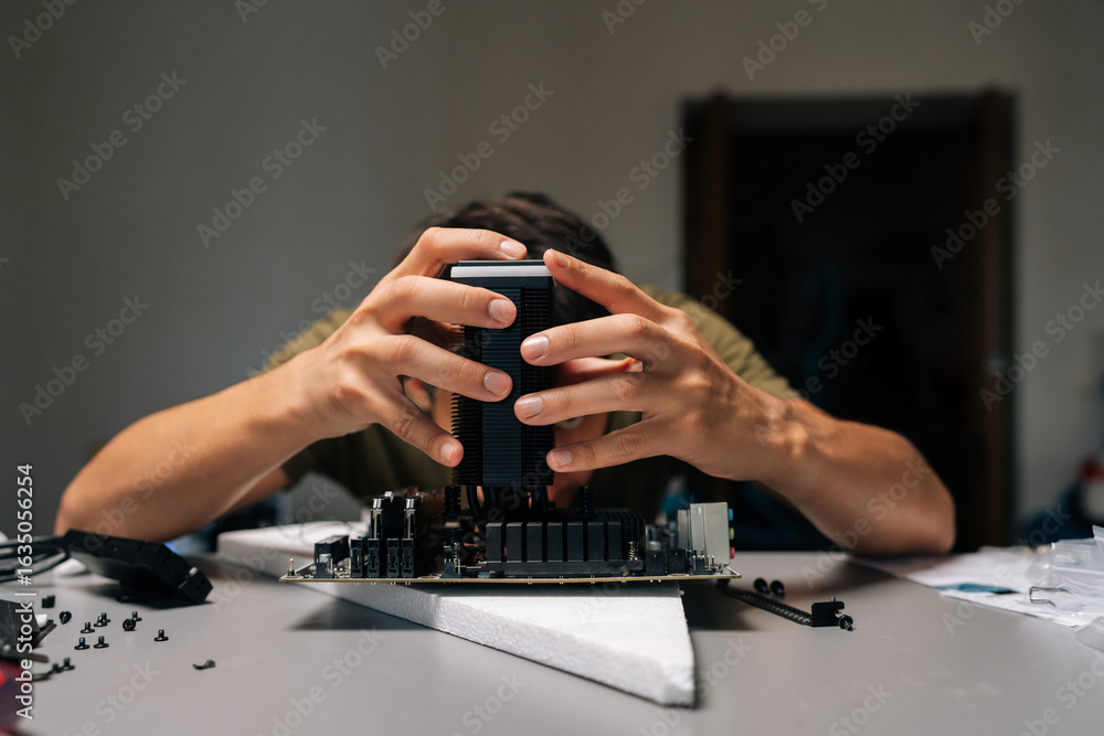 Poster computer technician installing cpu cooler onto motherboard, performing maintenance and repair work o