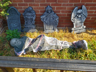 Creepy Halloween Display in Garden Setting. create a spooky yard scene.