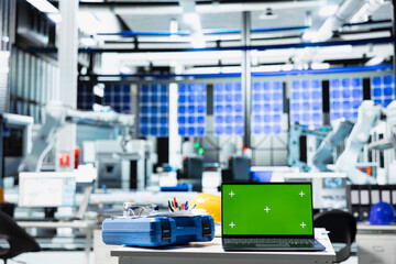 Isolated copy space display on laptop in solar cell manufacturing plant, solar power engineering...