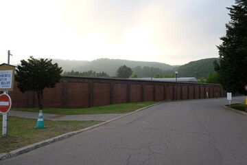 A brick wall with a red brick border