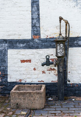 An old water pump in shropshire, offering a glimpse of rural history and weathered charm