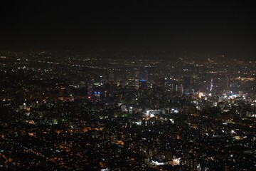 Obraz premium A city at night with many lights on