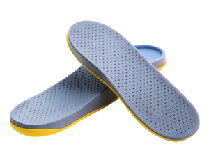 Pair of gray orthotic insoles for foot comfort and support isolated on transparent background