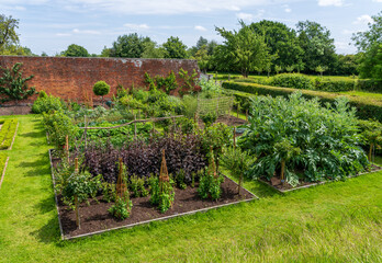 Well tended formal flower, vegetable and fruit gardens in the Shropshire countryside in England