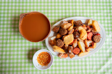Colombian Picada with Guarapo and Chili Sauce – Overhead View