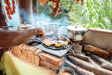 Traditional Santander Cuisine Grilling Over Wood-Fired Stove in Colombia