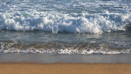 Waves breaking on the beach in Zipolite, Mexico