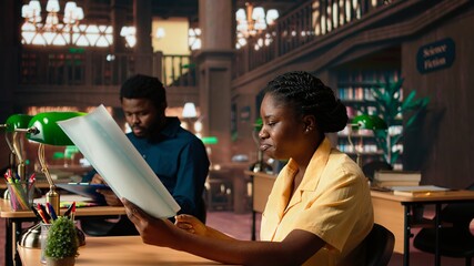 African american stressed scholar failing to comprehend and memorize lesson notes, struggling to...