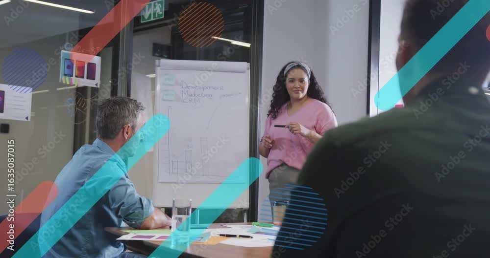 Poster presenter glancing at flipchart gesturing toward notes and graphs explaining marketing plan